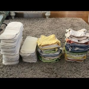107 pieces bum genius cloth diapers and inserts.